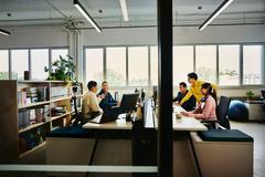 photo of a group of colleagues at their desks